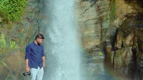 Man Standing in Front of Beautiful Waterfall in Gangtok, India on 1st July 2025 Stock Footage 327695576