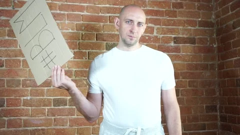 A man standing in front of a brick wall Stock Footage 134796717