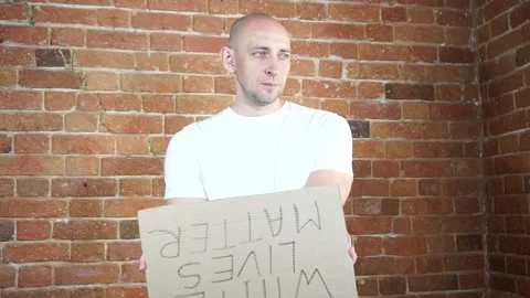 A man standing in front of a brick wall Video stock 134797025