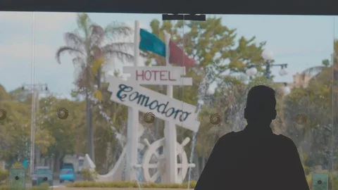 Man standing in front of a cuban hotel fountain Stock Footage 88764603