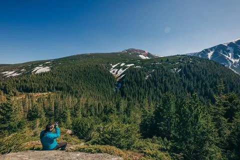 A man standing in front of a mountain Stock Photos