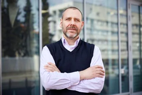 Man standing in front of office Stock Photos