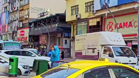 A man is standing in front of a pizza restaurant Stock Footage 272852211