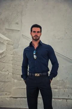 Man standing in front of a white wall 写真素材