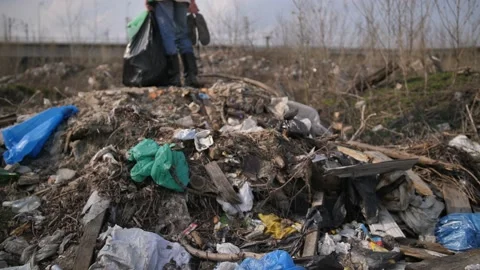 Man standing on garbage hill at landfill site Stock Footage 88879620