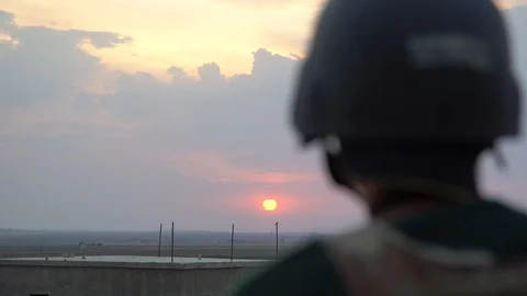 A Man Standing Guard at Sunset co Stock Footage 120930658