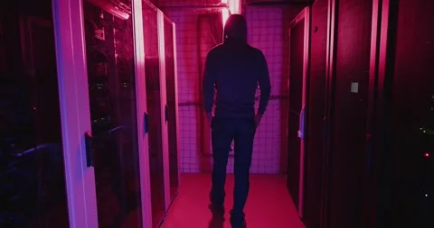 Man Standing in Hallway With Red Lights Stock Footage 278994413