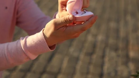 A man standing on his knee makes an offer to get married A man makes an offer to Stock-Footage 141059403