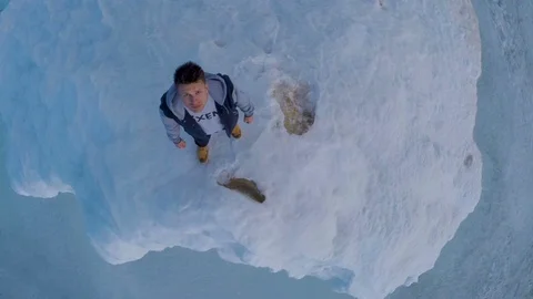 Man Standing On Iceberg Looking Up Into Sky Stock Footage 88675790