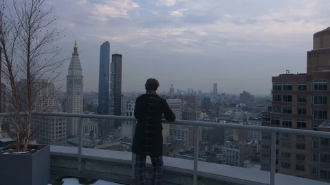 Man standing infront of Panoramic View over Manhattan from Skyscraper Rooftop Stock Footage 92578468