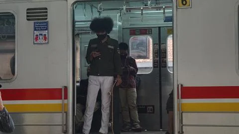 A man standing inside the train. Jakarta, Indonesia - September 21, 2020 Stock Photos