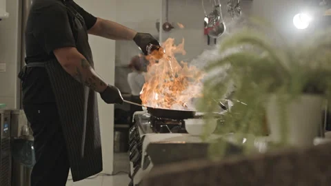 Man Standing in Kitchen Holding a Bottle of Beer Vidéo 262182967