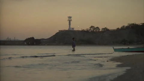 Man standing knee-deep in water Stock Footage 241353877