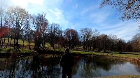 Man standing by the lake Stock Footage 128918069