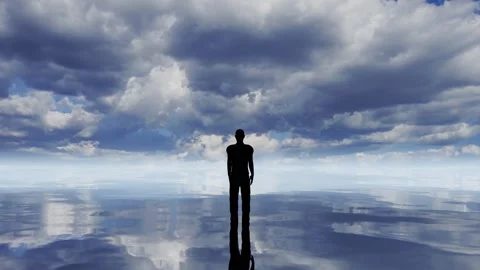 A man standing on a mirror lake, reflecting time lapse clouds movement Stock Footage 247436167