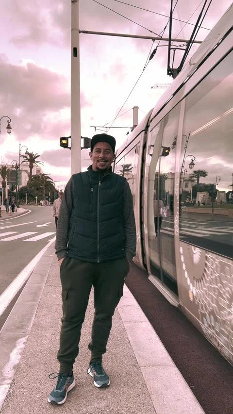 "Man Standing by Modern Tram in Morocco" Video stock 303966913