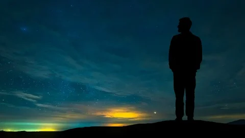 The man standing on the mountain against the night sky. time lapse Stock Footage 99059673
