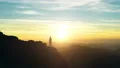 The man standing on the mountain and enjoying the sunset 4k or 4k+ Resolution