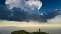 The man standing on a mountain with the beautiful cloud stream background 4k or 4k+ Resolution