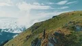 The man standing on the mountain cliff with beautiful landscape 4k or 4k+ Resolution