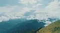 The man standing on a mountain cliff with beautiful landscape 4k or 4k+ Resolution