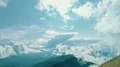 The man standing on a mountain cliff with the picturesque landscape 4k or 4k+ Resolution