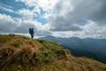 The man standing on the mountain on the cloud background Photo