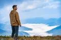 The man standing on the mountain landscape background Photo