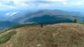 The man standing on the mountain with a picturesque landscape 4k or 4k+ Resolution