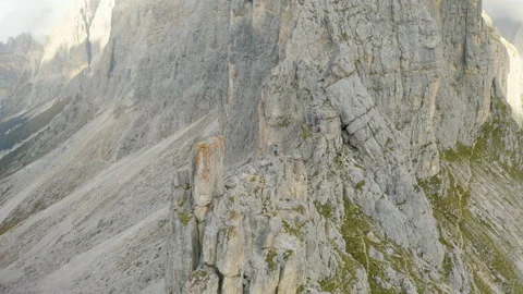 Man standing on mountain ridge epic drone view dolomites Stock Footage 143374068