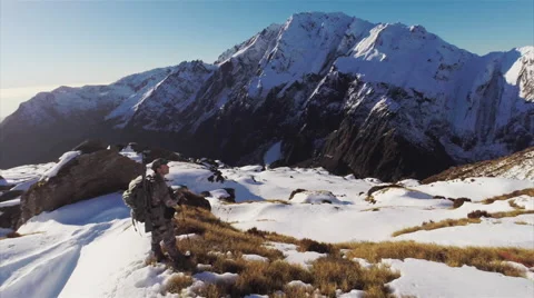Man standing on mountain side. Stock Footage 49832493