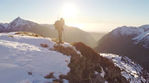 Man standing on mountain side glassing. Stock Footage 49832831