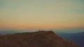 The man standing on mountain on a sunset background 4k or 4k+ Resolution