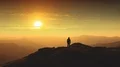 The man standing on a mountain top against a beautiful sunrise. time lapse 4k or 4k+ Resolution