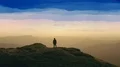 The man standing on a mountain top with the beautiful landscape 4k or 4k+ Resolution