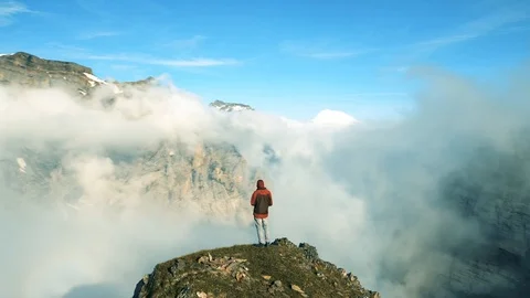 Man standing in the mountains enjoying the view Stock Footage 113115128