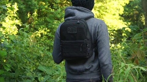Man standing in Nature Forest with Backpack Stock Footage 111856572