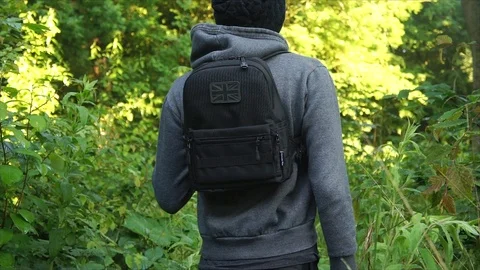 Man standing in Nature Forest with Backpack Stock Footage 111856590