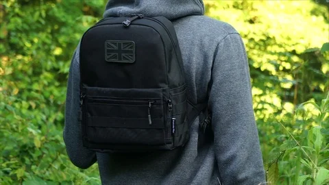 Man standing in Nature Forest with Backpack Stock Footage 111856670
