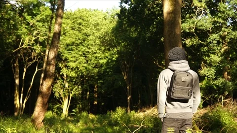 Man standing in Nature Forest with Backpack Stock Footage 111856703