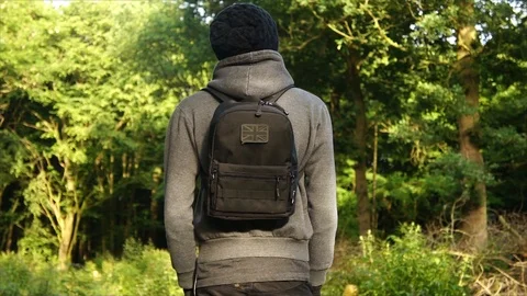 Man standing in Nature Forest with Backpack Stock Footage 111856786