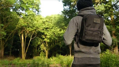 Man standing in Nature Forest with Backpack Stock Footage 111856812