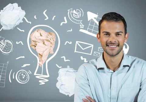Man standing next to light bulb with crumpled paper ball Stock Photos