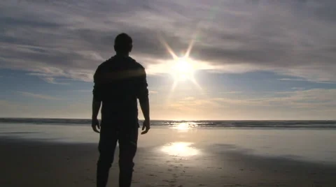 Man Standing at Peaceful Beach Video stock 48238524