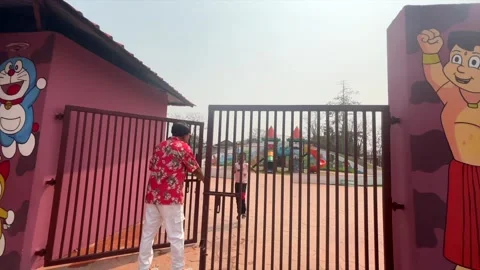 Man Standing at Playground Gate in Public Recreation Park in Dibrugarh 스톡 동영상 334774030