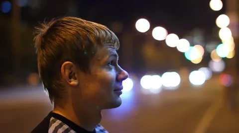 The Man Is Standing In Profile And Talking Video stock 42740274