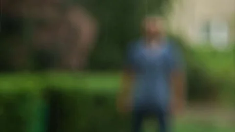 The Man Standing with Raised up Hands and Closed Eyes is Enjoying Summer Warm Stock Footage 78940904