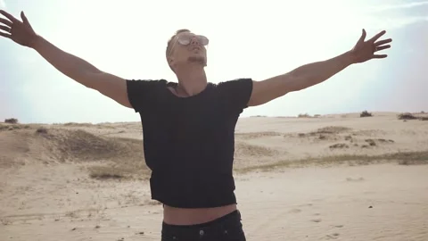 Man standing with raised hands Stock Footage 89697415