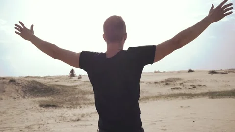 Man standing with raised hands Stock Footage 89700033