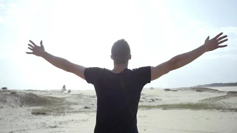 Man standing with raised hands Stock Footage 89701429